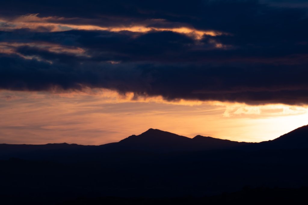 a mountain range with a sunset